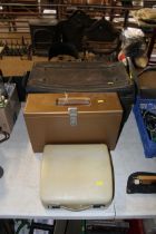 A small metal storage trunk, a metal case filing b