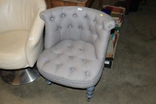 A button down upholstered tub chair