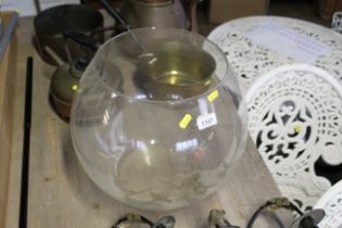 A large glass open topped fish bowl