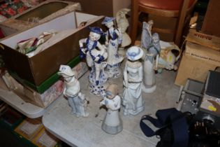 A quantity of Lladro style figures and other decor