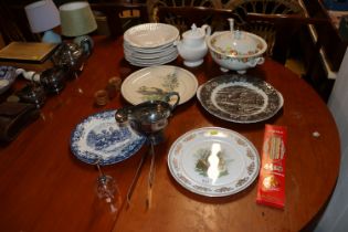 A collection of various patterned dinnerware; silv