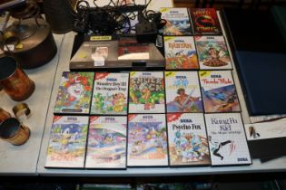 A Sega Master System with various boxed games