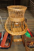 A wooden high chair and a wicker chair