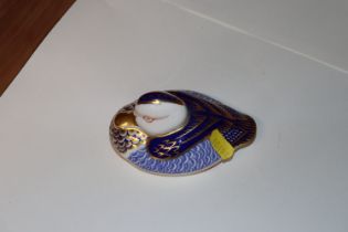 A Royal Crown Derby paperweight in the form of a d