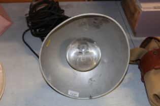 A hanging industrial style light fitting sold as a