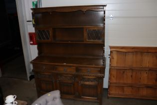 An Old Charm oak and leaded glazed dresser