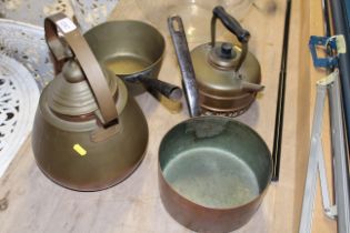 Two metal saucepans and two metal kettles