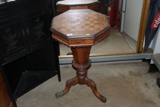 A Victorian walnut trumpet sewing table and games