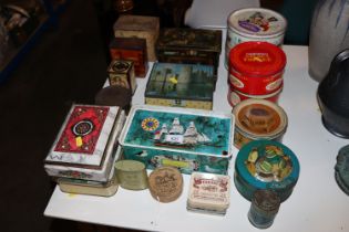 A collection of various advertising tins