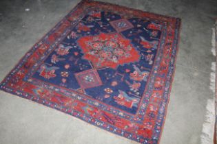 An approx. 6'4" x 5'3" Eastern patterned red and b