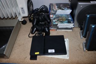 A Sony PlayStation II with two controllers and var