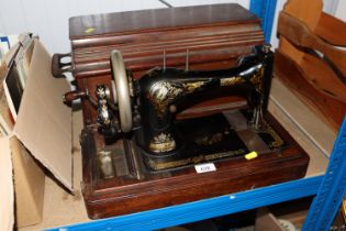 A Singer hand sewing machine