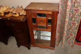 A late Victorian mirror fronted cabinet