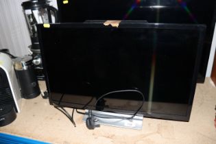 A Toshiba television with remote control