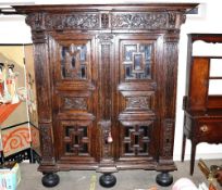 An early 18th Century North German oak "Zeeuwse Kast" or cupboard, enclosed by moulded panel doors