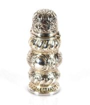 A Victorian silver baluster sugar shaker, with rich foliate embossed decoration, 13cm high,