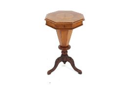 A Victorian walnut trumpet shaped work table, the octagonal lifting top opening to reveal a