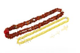 A natural amber necklace, with a large coral piece to the middle; together with nine natural pearl /