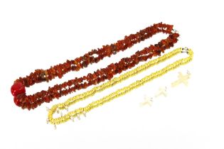 A natural amber necklace, with a large coral piece to the middle; together with nine natural pearl /