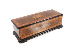 A Swiss music box and associated table stand, playing 18 tunes on three interchangeable  11