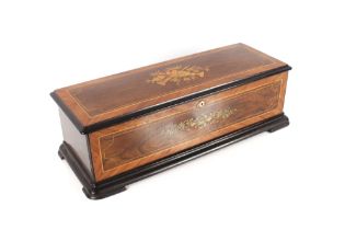 A Swiss music box and associated table stand, playing 18 tunes on three interchangeable  11"