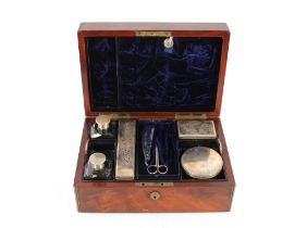 A 19th Century mahogany and brass mounted travelling toilet box, fitted scent bottles and tidy