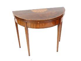 An early 19th Century mahogany rosewood cross banded and satinwood strung demi-lune card table,