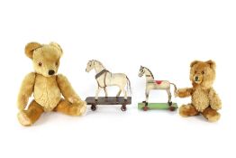 A large Teddy bear by Farnell; a smaller Teddy bear with makers label; an antique toy horse on