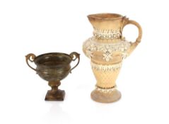 A large continental pottery ewer, with raised cream foliate and fruit decoration, 33cm high; and a