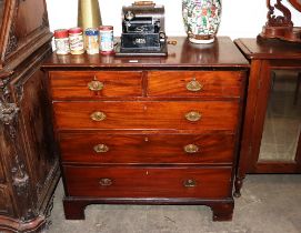 A 19th Century mahogany chest, fitted two short and three long graduated drawers raised on bracket