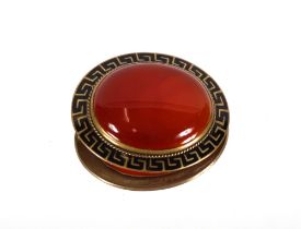 An antique agate brooch in enamelled frame