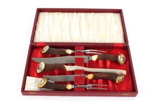 A mid-20th Century good quality cased stag handle double carving set