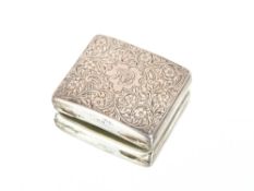 An Edwardian silver pipe tobacco box, with integral tamper, the lid with foliate decoration and