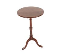 A 19th Century mahogany tripod occasional table, the circular top raised on baluster turned