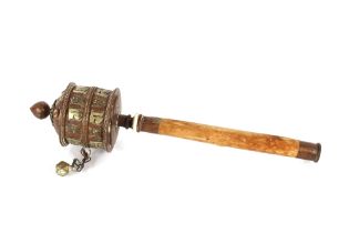 A Tibetan wood and metal prayer wheel