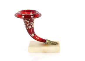 A 19th Century ruby glass Cornucopia hand vase, with floral decoration on onyx plinth, 18cm high