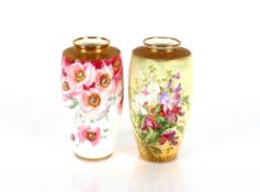 Two floral decorated Minton baluster vases, the shoulders heightened in gilt, 18cm high
