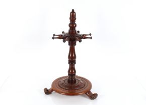 An unusual 19th Century mahogany revolving stand having turned column and eight rounded tapering