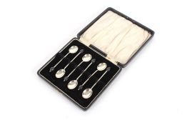 A cased set of six silver bean end coffee spoons, Sheffield 1922