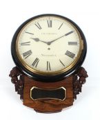 A 19th Century rosewood cased wall clock, having carved foliate decoration, circular white enamel