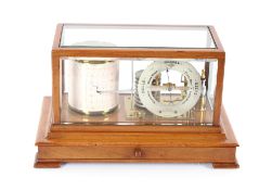 A barograph by J. F. Hunt, Hull and Scarborough, having bevelled glass panels, chart drawer to the
