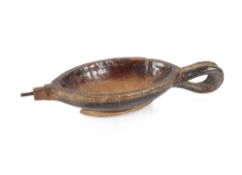 An African wooden pourer of oval shape having metal spout and loop handle, 29cm long