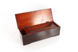 An early Victorian music box, playing six airs in rosewood and cross banded case, 12