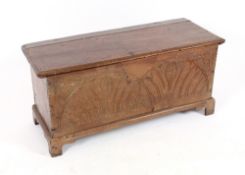 An 18th Century oak coffer, having foliate carved front raised on bracket supports, 100cm wide
