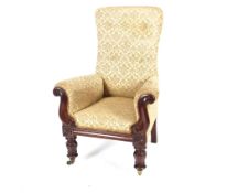 A late Victorian high back armchair, the scroll arms raised on octagonal fluted supports terminating