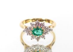 An 18ct gold emerald and diamond cluster ring, the central oval; emerald in raised claw setting with