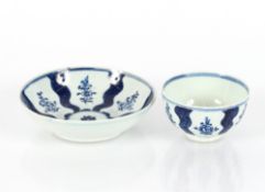 An 18th Century English porcelain blue and white tea bowl and saucer
