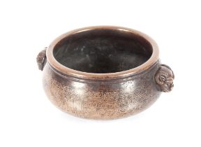 A Chinese bronze censer, with silvered wire decoration flanked by animal head bosses, impressed seal