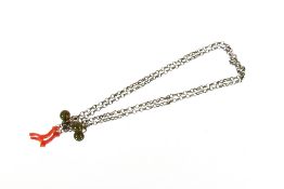 An antique silver chain, set with two agate beads and natural coral piece; together with an ebony