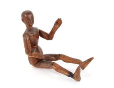 A 19th Century wooden artists lay mannequin, 35cm long